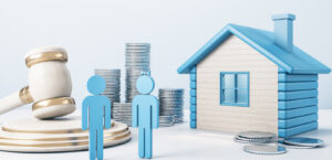 Blue house with coin stacks as a couple agree a property and financial settlement after divorce